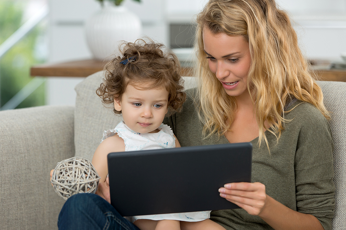 Whimsifull-mother and daughter watching tv on tablet